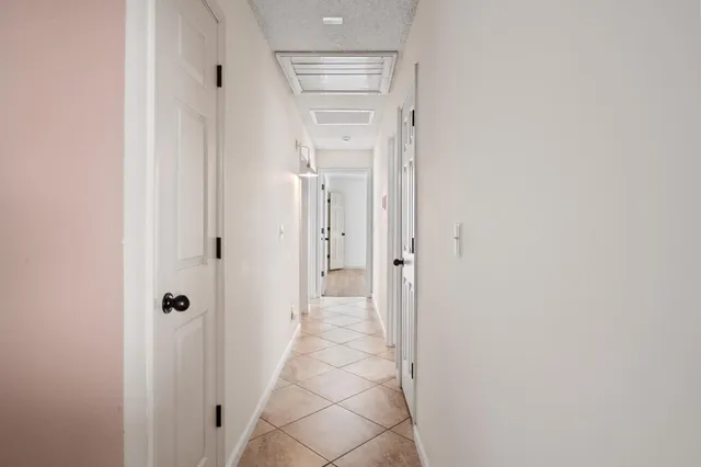 a view of a bathroom from a hallway