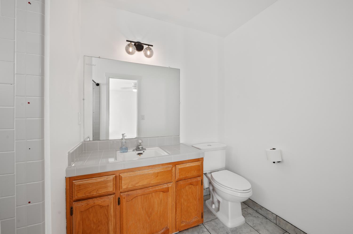 38570 Rustic Lane Squaw Valley, CA 93675 - Photo 20 of 43 a bathroom with a toilet sink and mirror