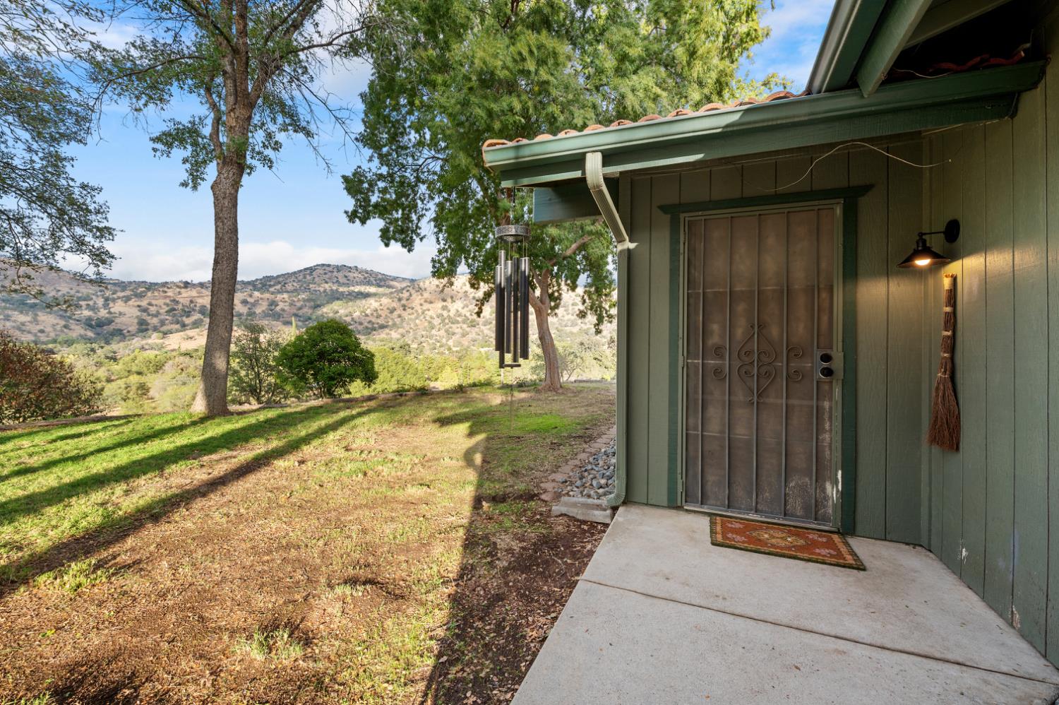 38570 Rustic Lane Squaw Valley, CA 93675 - Photo 2 of 43 a view of a porch with a tree