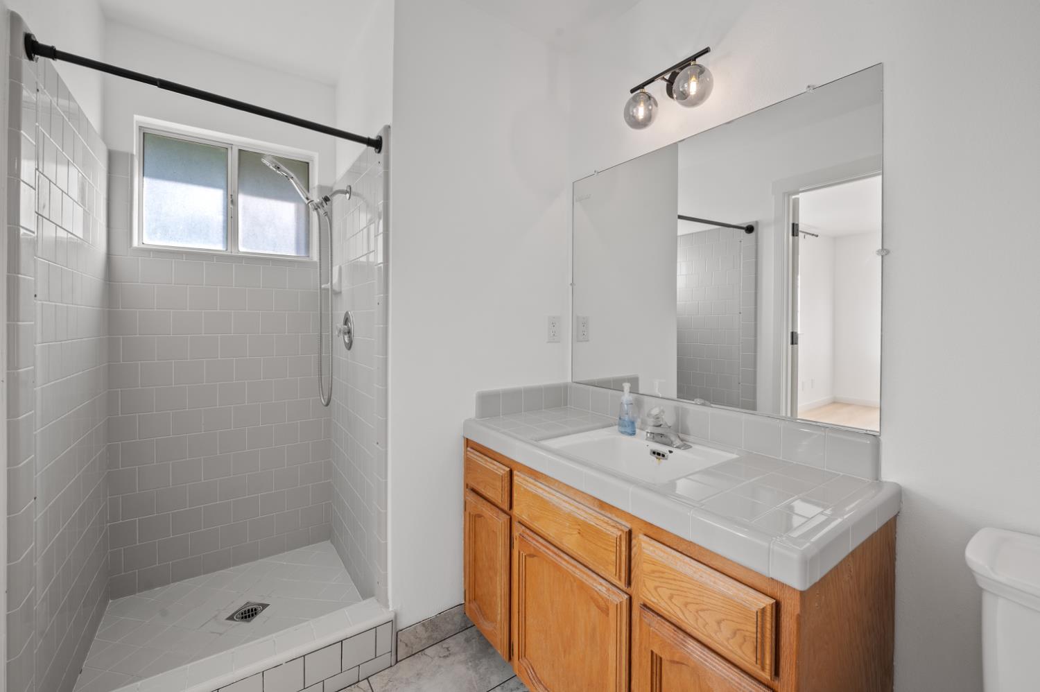 38570 Rustic Lane Squaw Valley, CA 93675 - Photo 21 of 43 a bathroom with a sink a shower and a mirror
