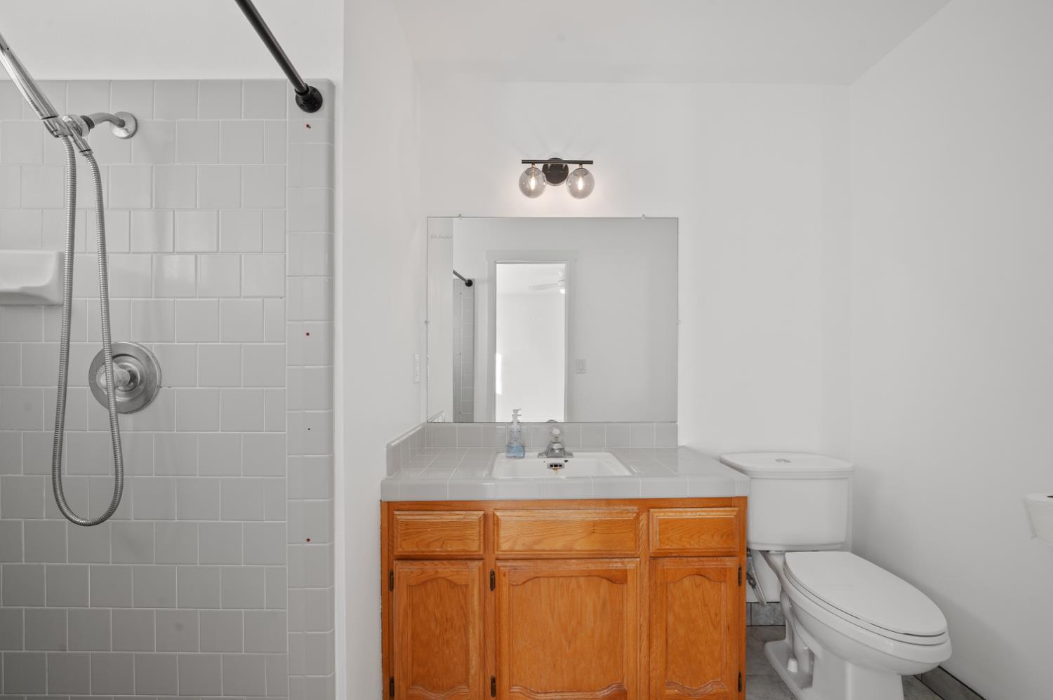 38570 Rustic Lane Squaw Valley, CA 93675 - Photo 22 of 43 a bathroom with a granite countertop sink toilet and shower
