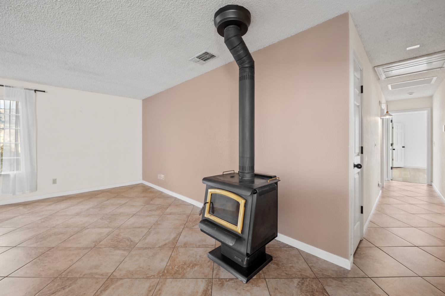 38570 Rustic Lane Squaw Valley, CA 93675 - Photo 4 of 43 a view of a hallway with washer and dryer