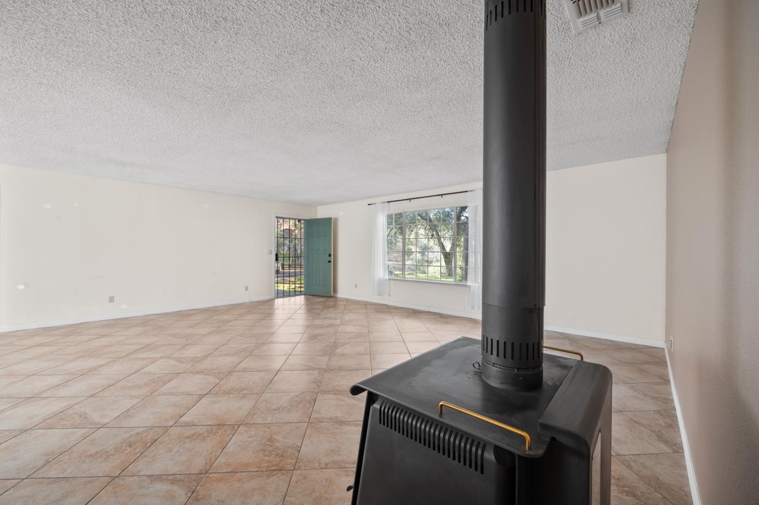 38570 Rustic Lane Squaw Valley, CA 93675 - Photo 5 of 43 a view of an empty room and window
