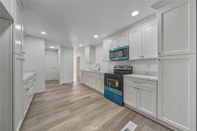 a view of cabinets with wooden floor