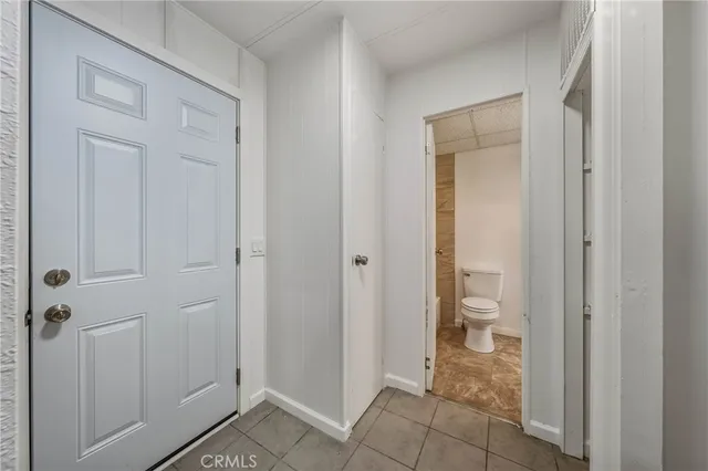 a view of a bathroom with a glass door shower and a sink