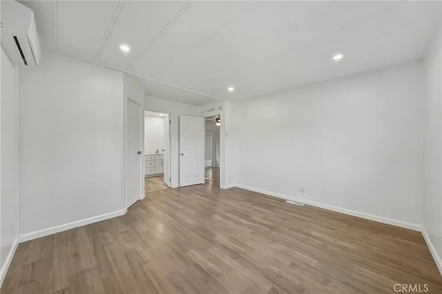 a view of a house with a door and wooden walls