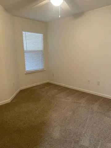 a white toilet sitting next to a bath tub