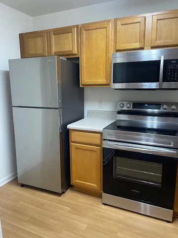 a kitchen with a microwave stove and a microwave