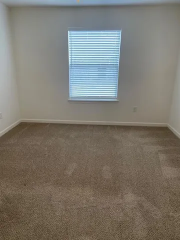 a view of a room that has a window in it