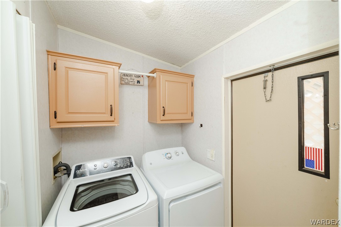 3003 Hualapai Mountain Road Kingman, AZ 86401 - Photo 15 of 49 a view of storage and utility room with washer and dryer