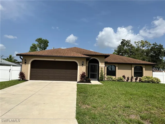 a view of house with yard
