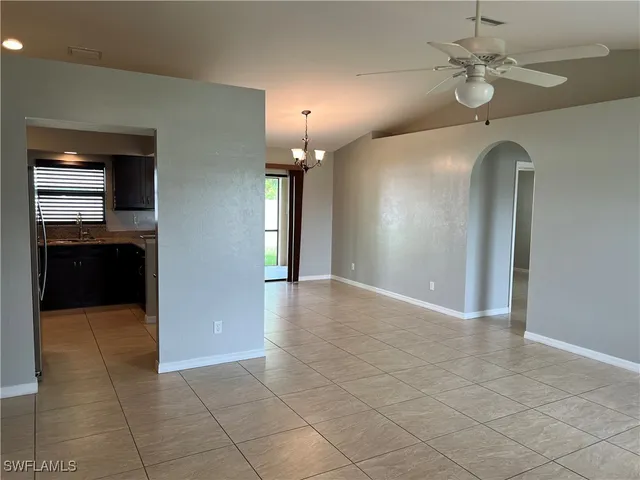 a view interior of a house chandelier and fire place