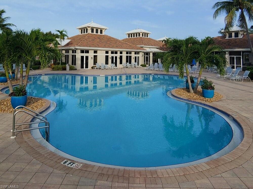 3144 Sundance Circle Naples, FL 34109 - Photo 20 of 26 Community pool with a patio