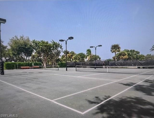 3144 Sundance Circle Naples, FL 34109 - Photo 25 of 26 View of tennis court with community basketball court