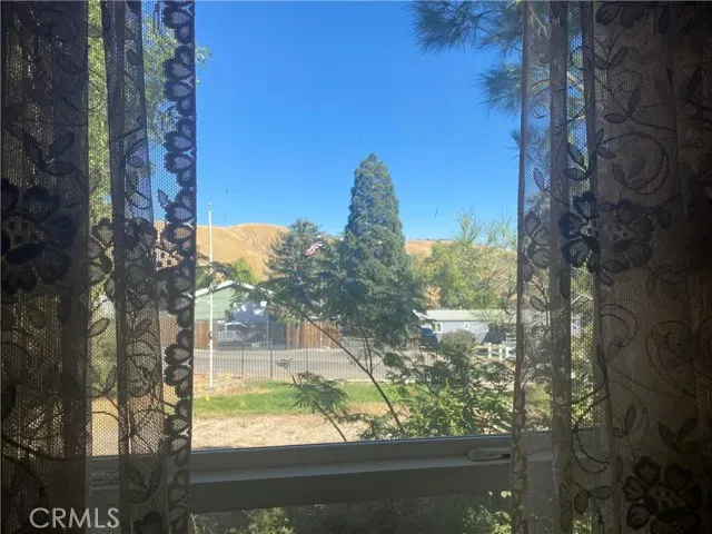 a view of a yard from a balcony