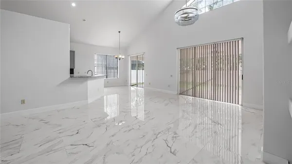 a view of a brick house with many windows