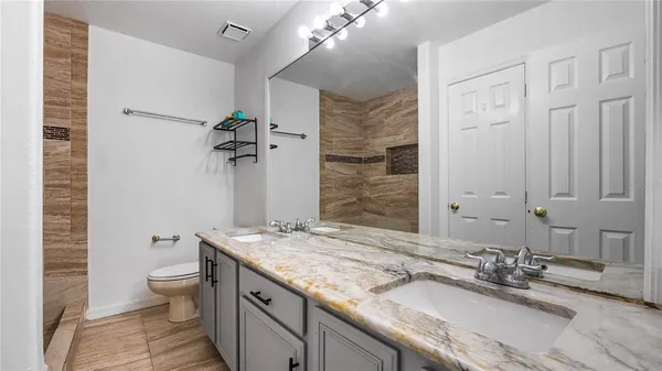 a view of a hallway with a outdoor space