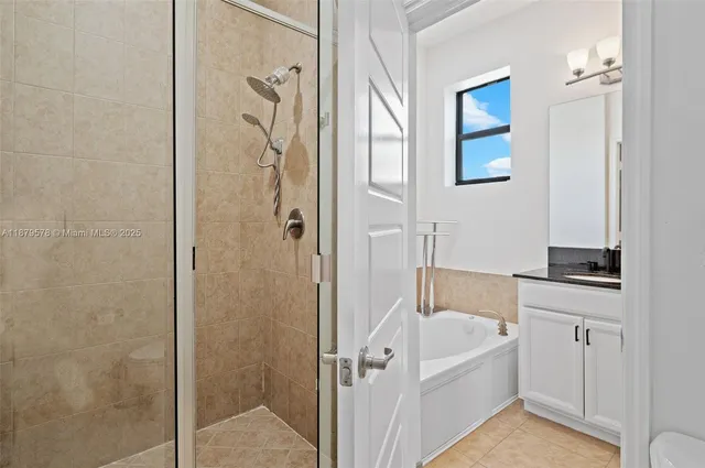 a bathroom with a bathtub and a shower