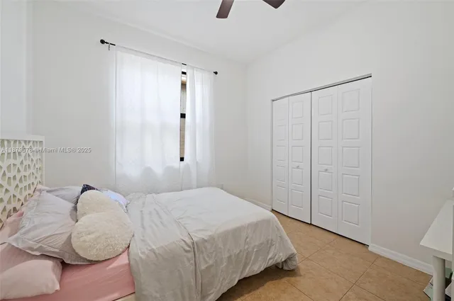 a bedroom with a bed and a shower