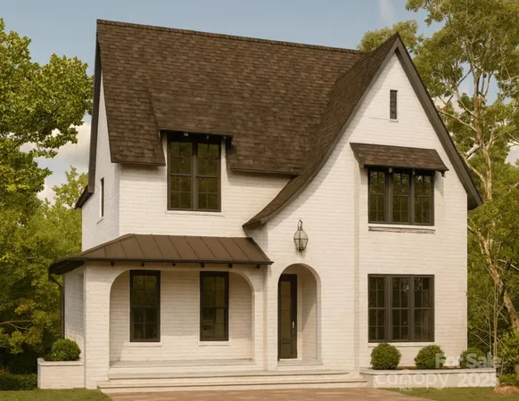 a front view of a house with white fence
