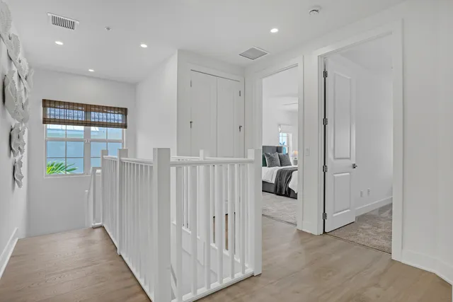 a view of a hallway with closet and entryway