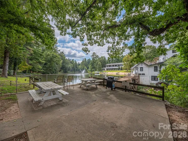 a wooden bench sitting next to a lake