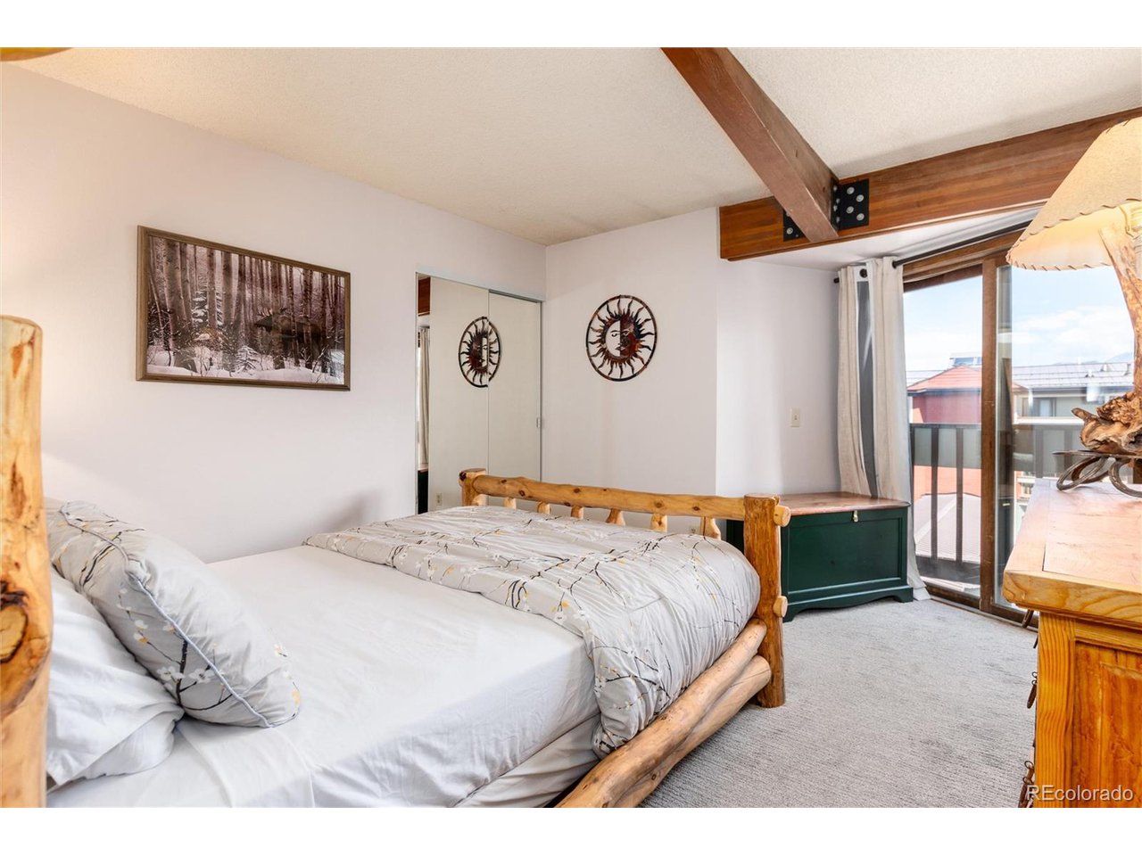 490 Kings Crossing Road, Unit 631 Winter Park, CO 80482 - Photo 29 of 43 a bedroom with a bed and a large mirror
