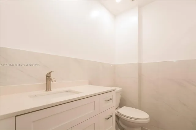 a bathroom with a sink a toilet