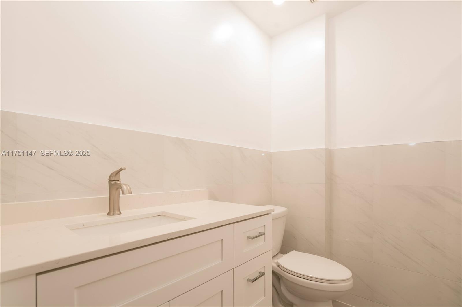 19444 Northwest 79th Court Hialeah, FL 33015 - Photo 20 of 26 a bathroom with a sink a toilet