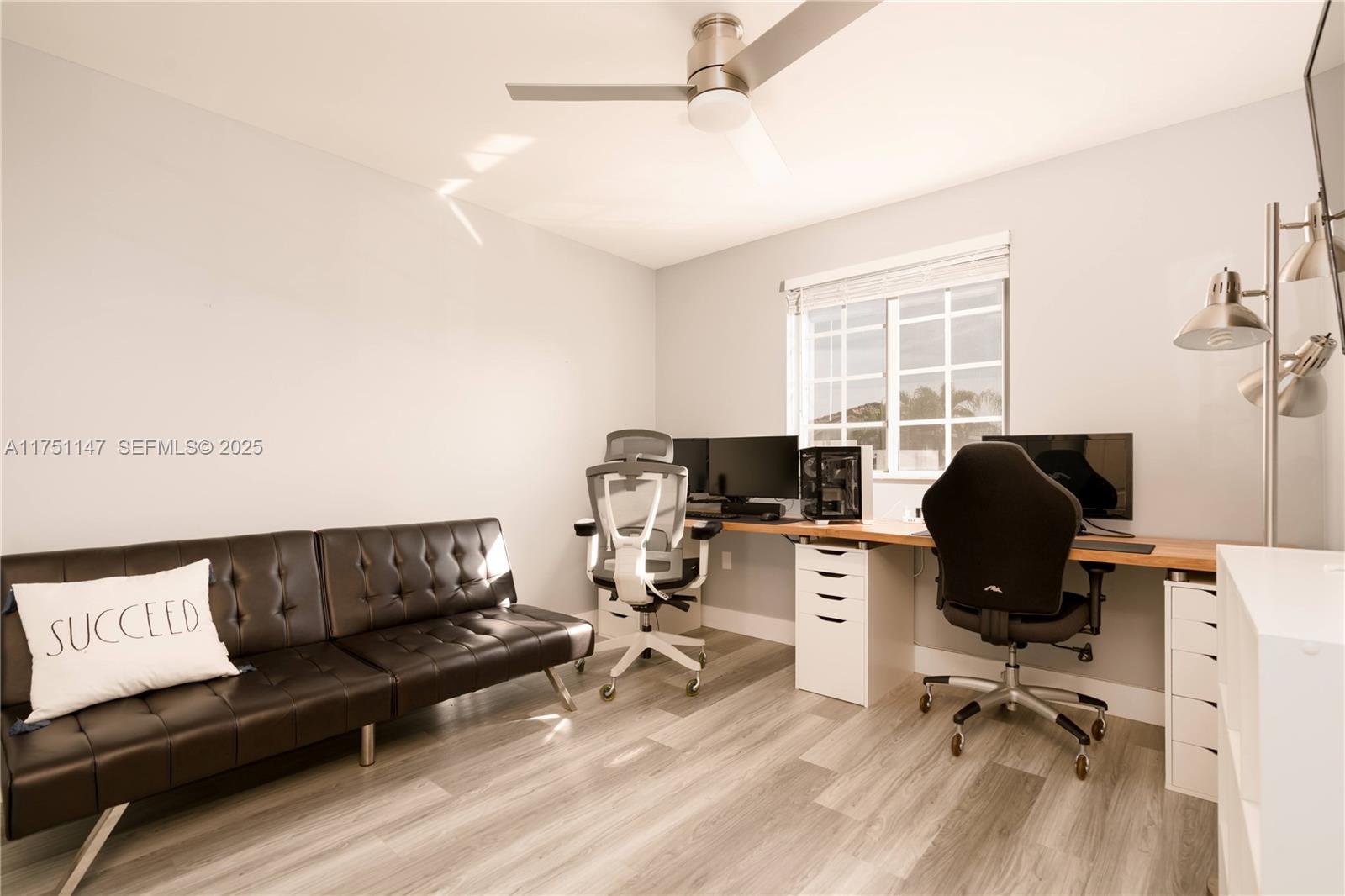 19444 Northwest 79th Court Hialeah, FL 33015 - Photo 22 of 26 a view of a workspace with furniture and a window
