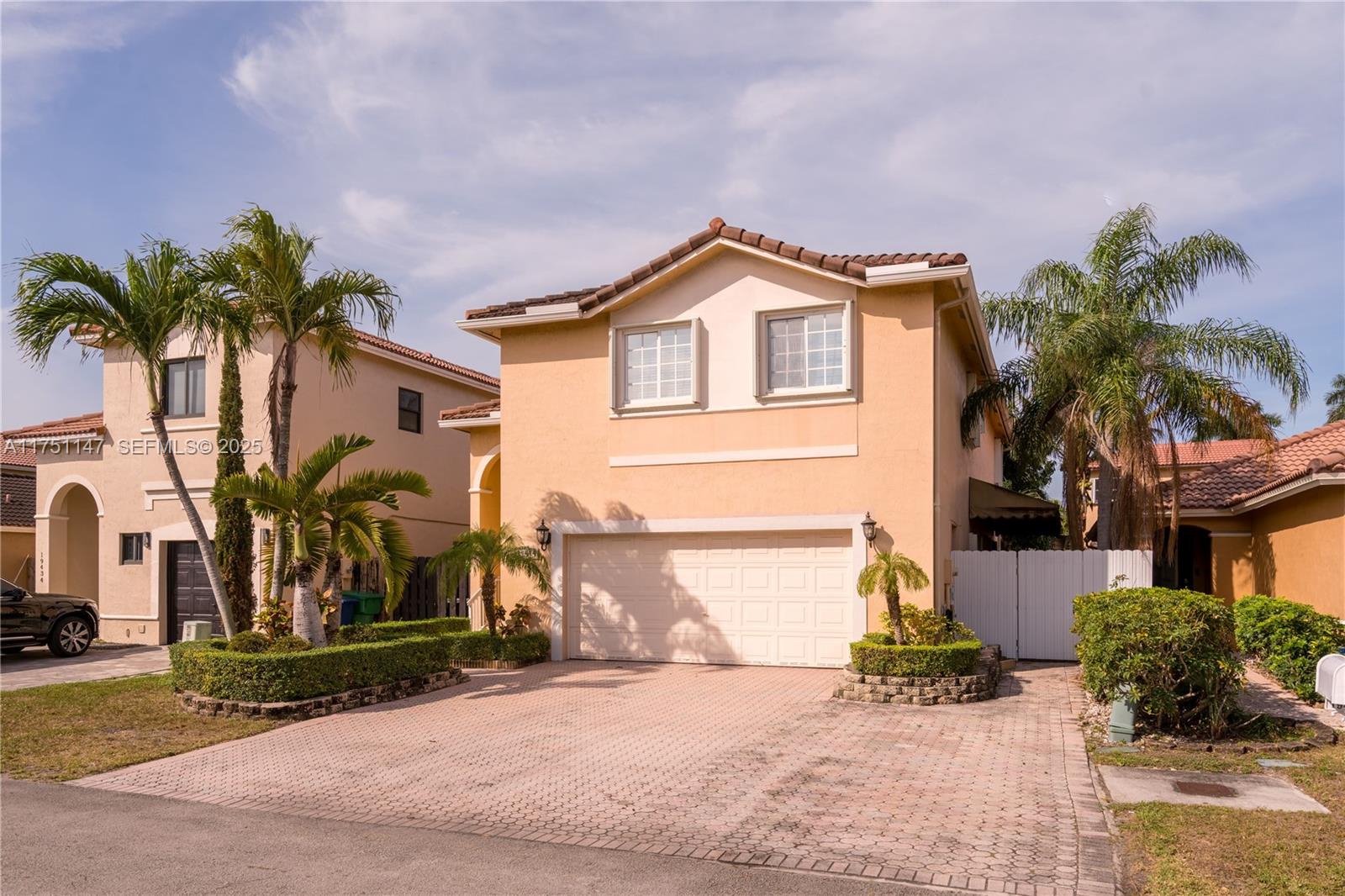 19444 Northwest 79th Court Hialeah, FL 33015 - Photo 26 of 26 a front view of a house with garden