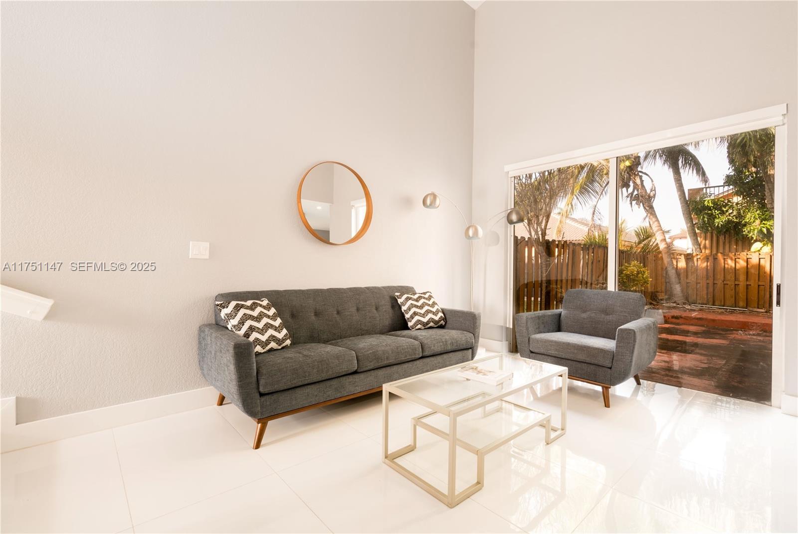 19444 Northwest 79th Court Hialeah, FL 33015 - Photo 7 of 26 a living room with furniture and a large window