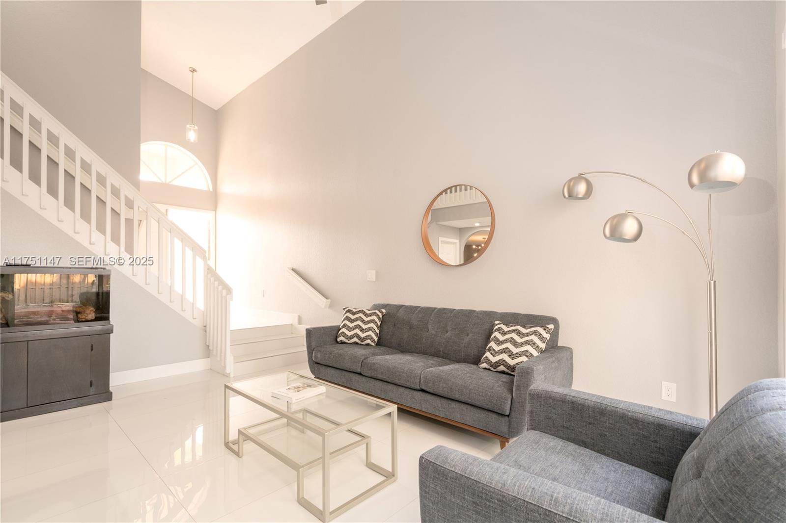 19444 Northwest 79th Court Hialeah, FL 33015 - Photo 9 of 26 a living room with furniture and a fireplace