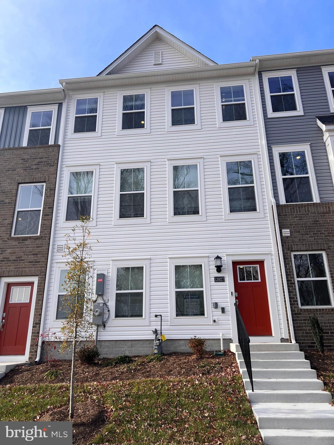 a view of a brick building with many windows