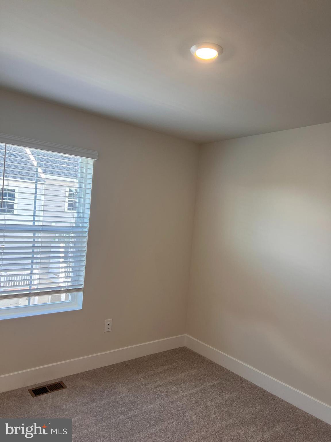 13927 Anderson Garden Road Laurel, MD 20707 - Photo 11 of 31 an empty room with a window