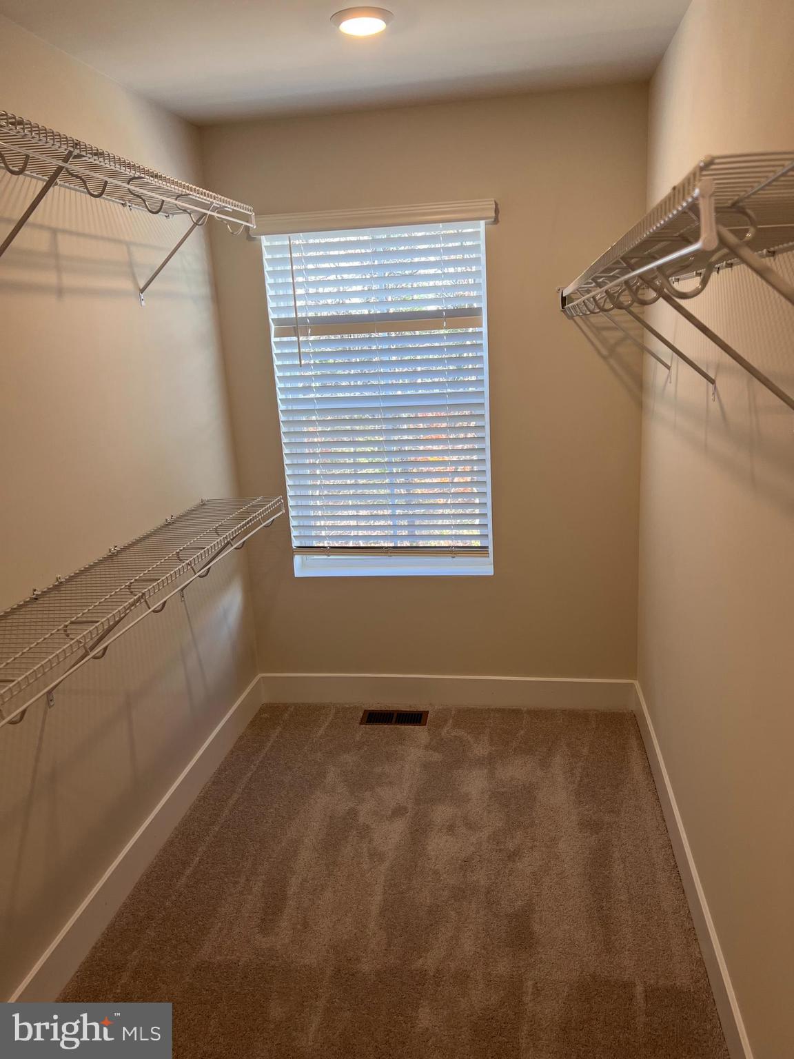 13927 Anderson Garden Road Laurel, MD 20707 - Photo 3 of 31 a view of a room with racks on the wall