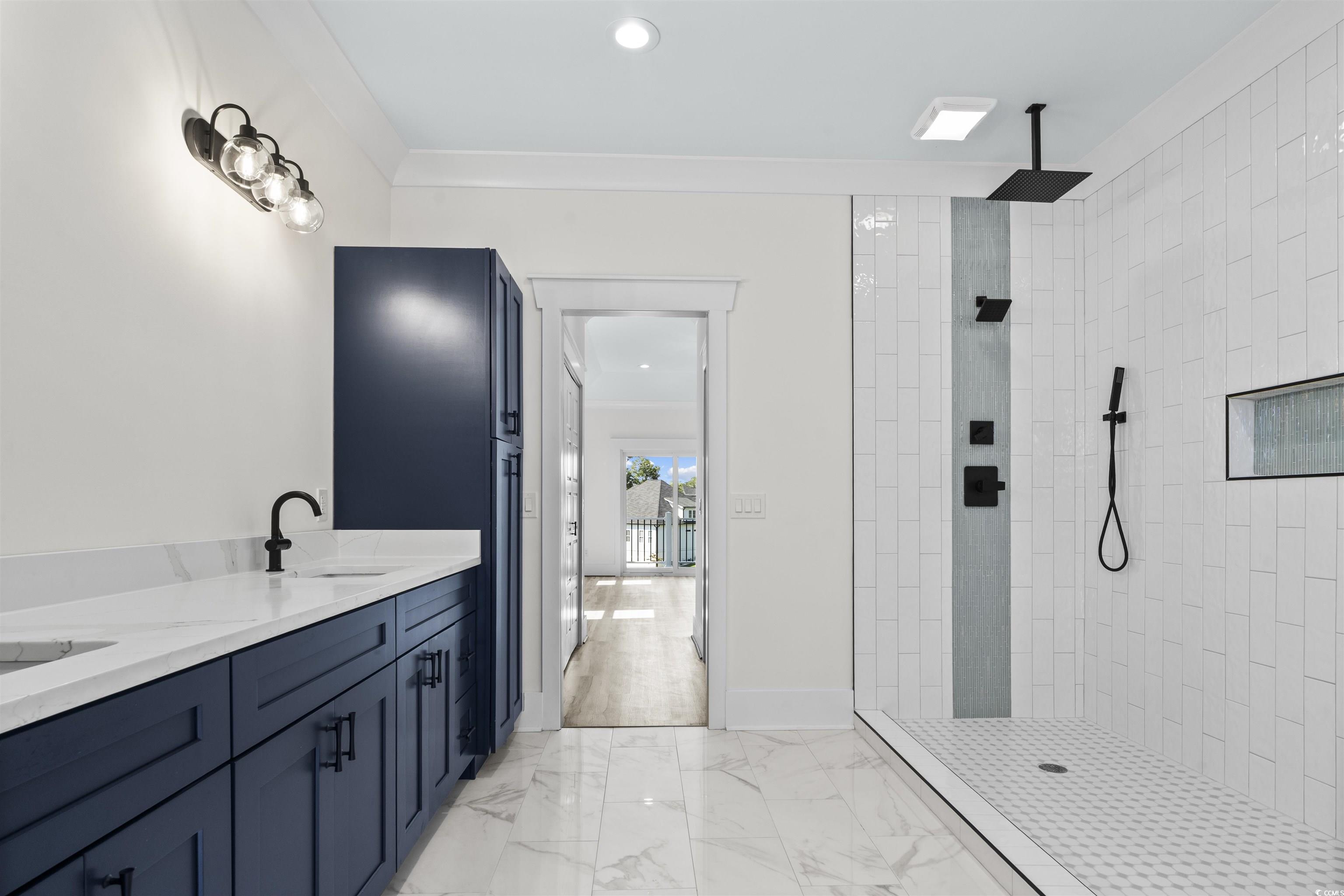 1017 Hyatt Pond Road North Myrtle Beach, SC 29582 - Photo 15 of 39 Bathroom featuring walk in shower, marble look tiles, double vanity, and recessed lighting