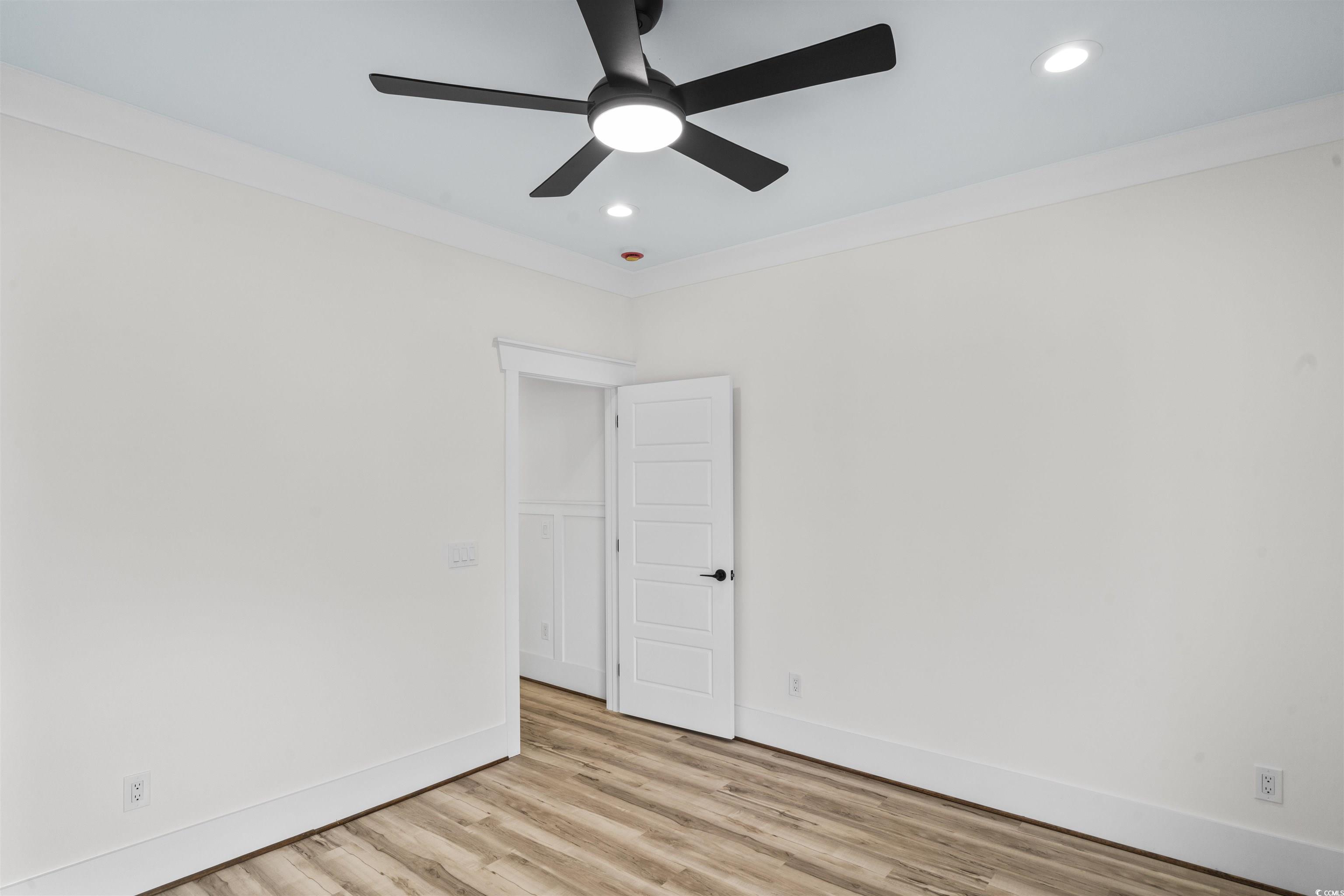 1017 Hyatt Pond Road North Myrtle Beach, SC 29582 - Photo 21 of 39 Bedroom featuring ceiling fan, wood finished floors, recessed lighting, and ornamental molding