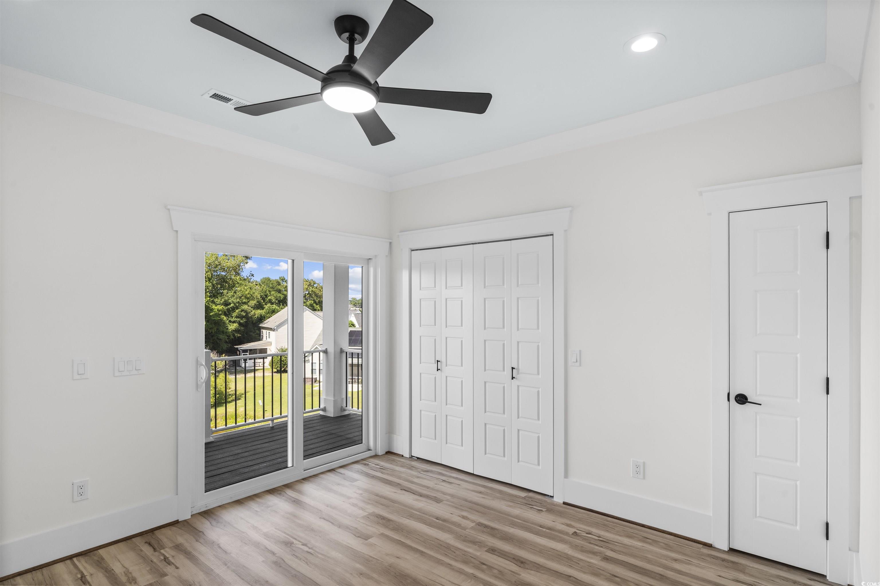 1017 Hyatt Pond Road North Myrtle Beach, SC 29582 - Photo 26 of 39 Unfurnished bedroom with access to outside, wood finished floors, recessed lighting, ceiling fan, and a closet