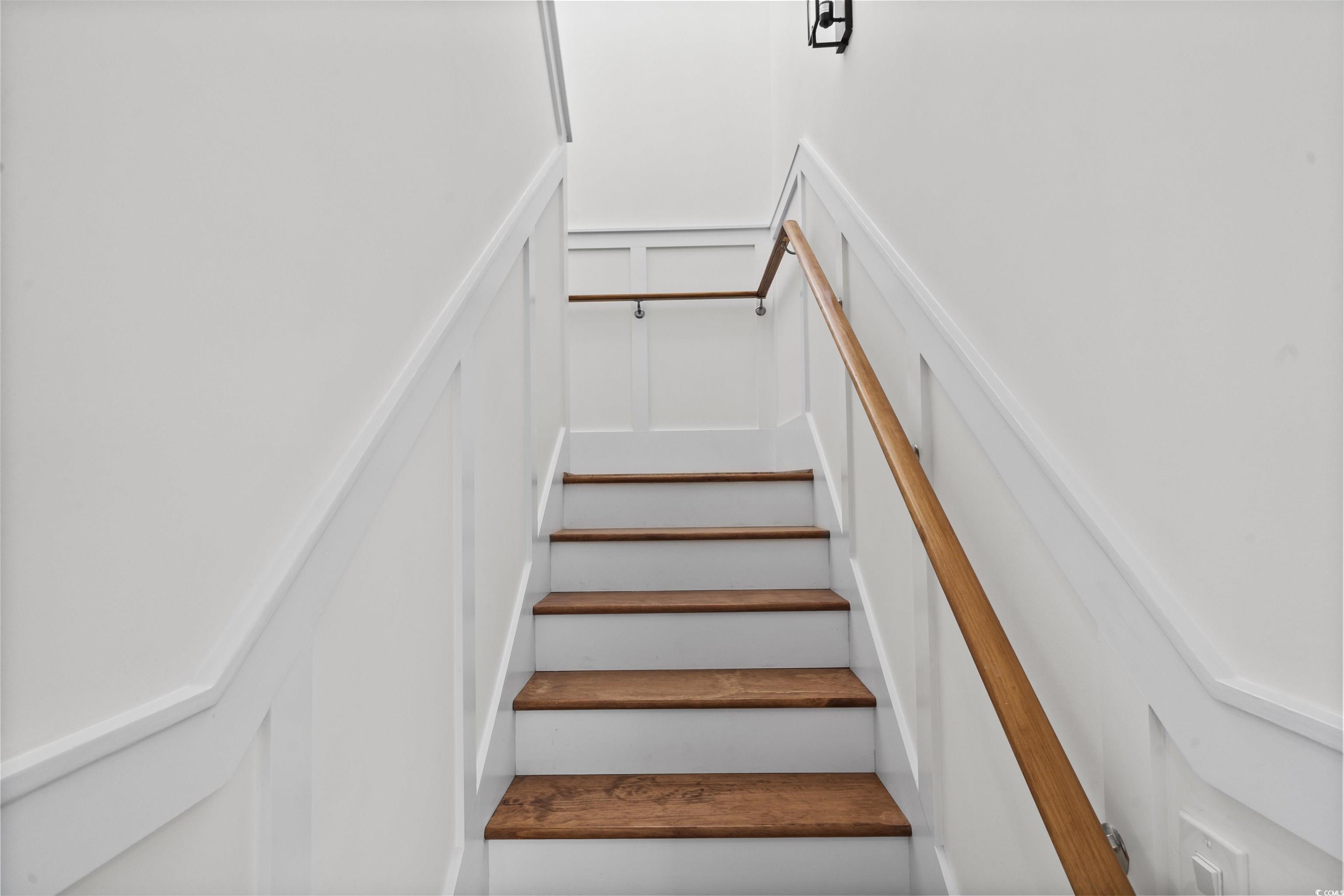1017 Hyatt Pond Road North Myrtle Beach, SC 29582 - Photo 10 of 39 Staircase with a decorative wall