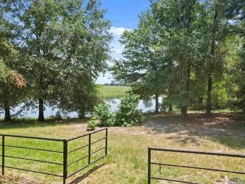 429 Private Road Big Sandy, TX 75755 - Photo 7 of 24 Gate featuring a view of backyard leading to the private dock area