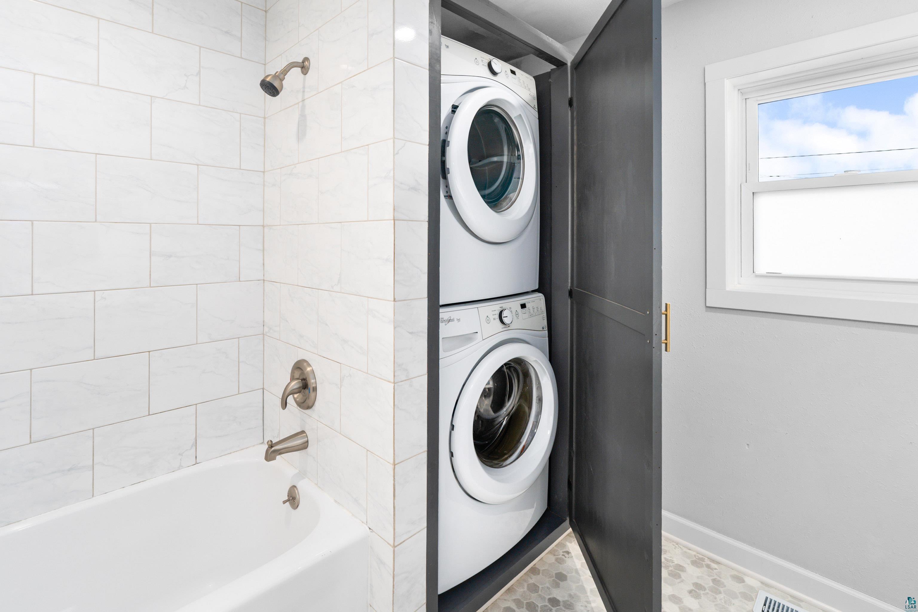 524 14th Avenue Two Harbors, MN 55616 - Photo 17 of 36 Full bath with bathtub / shower combination and estacked washer and dryer