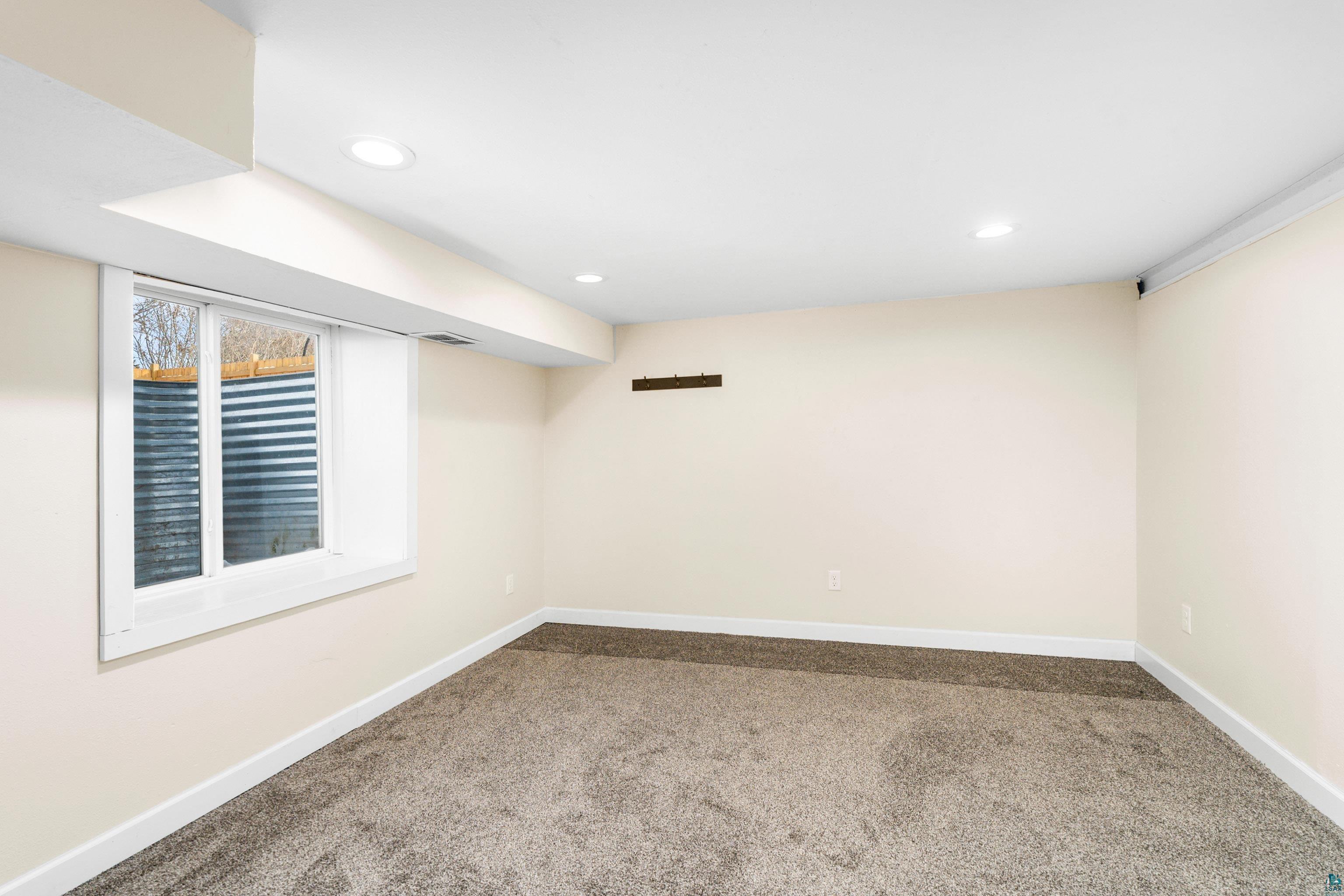 524 14th Avenue Two Harbors, MN 55616 - Photo 25 of 36 Basement featuring carpet and recessed lighting