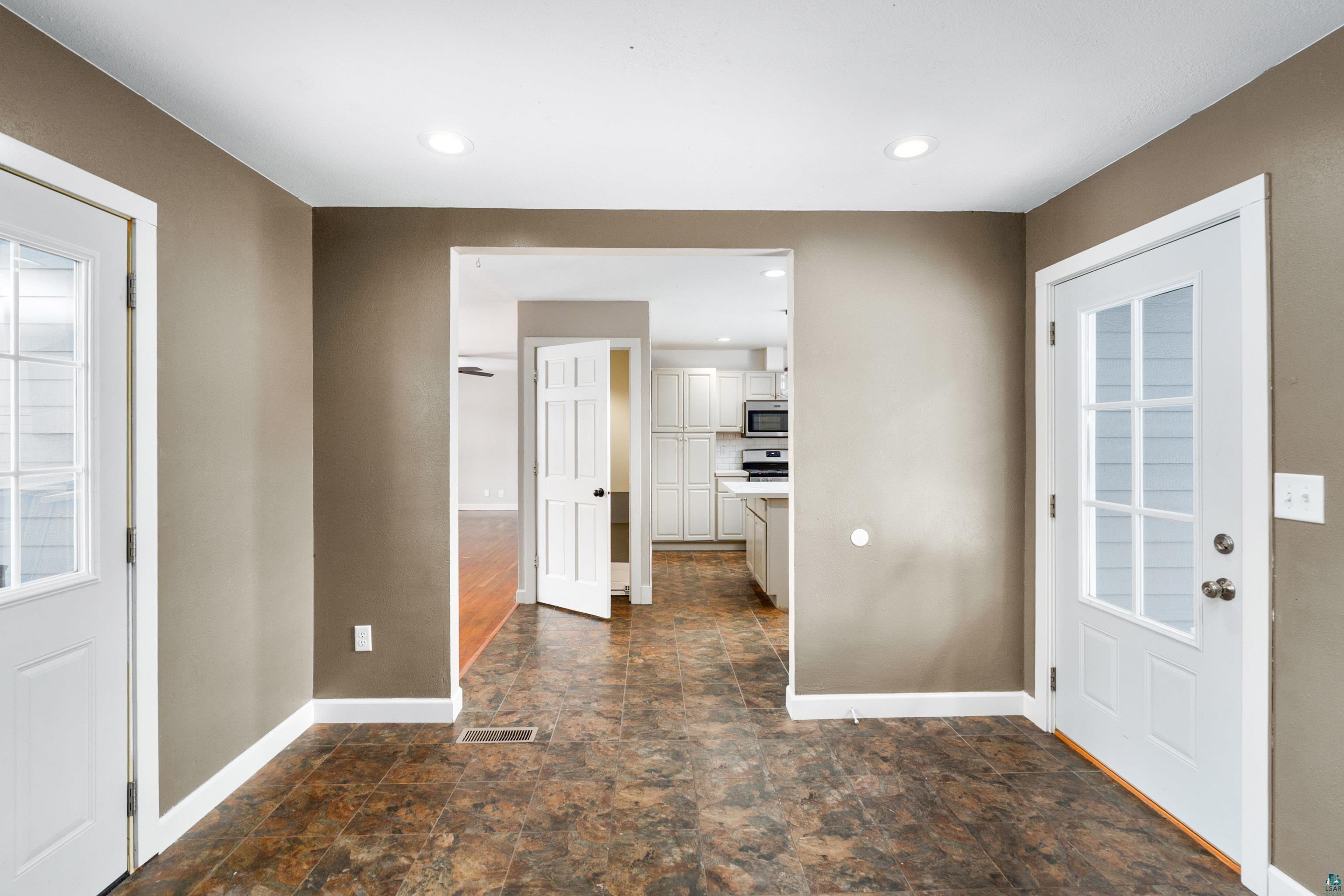 524 14th Avenue Two Harbors, MN 55616 - Photo 4 of 36 Entrance foyer featuring stone finish floors and recessed lighting