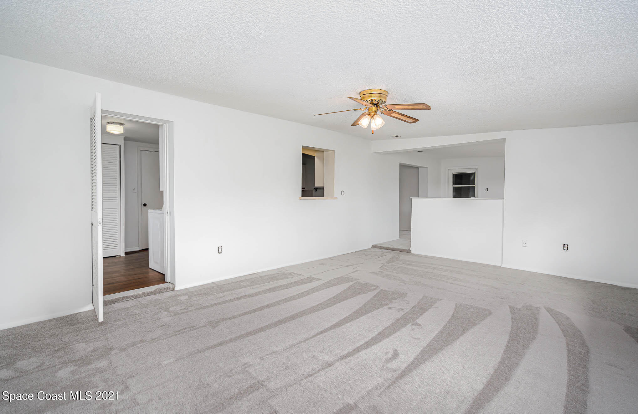 2127 Fatzler Road Melbourne, FL 32935 - Photo 11 of 21 a view of empty room with ceiling fan