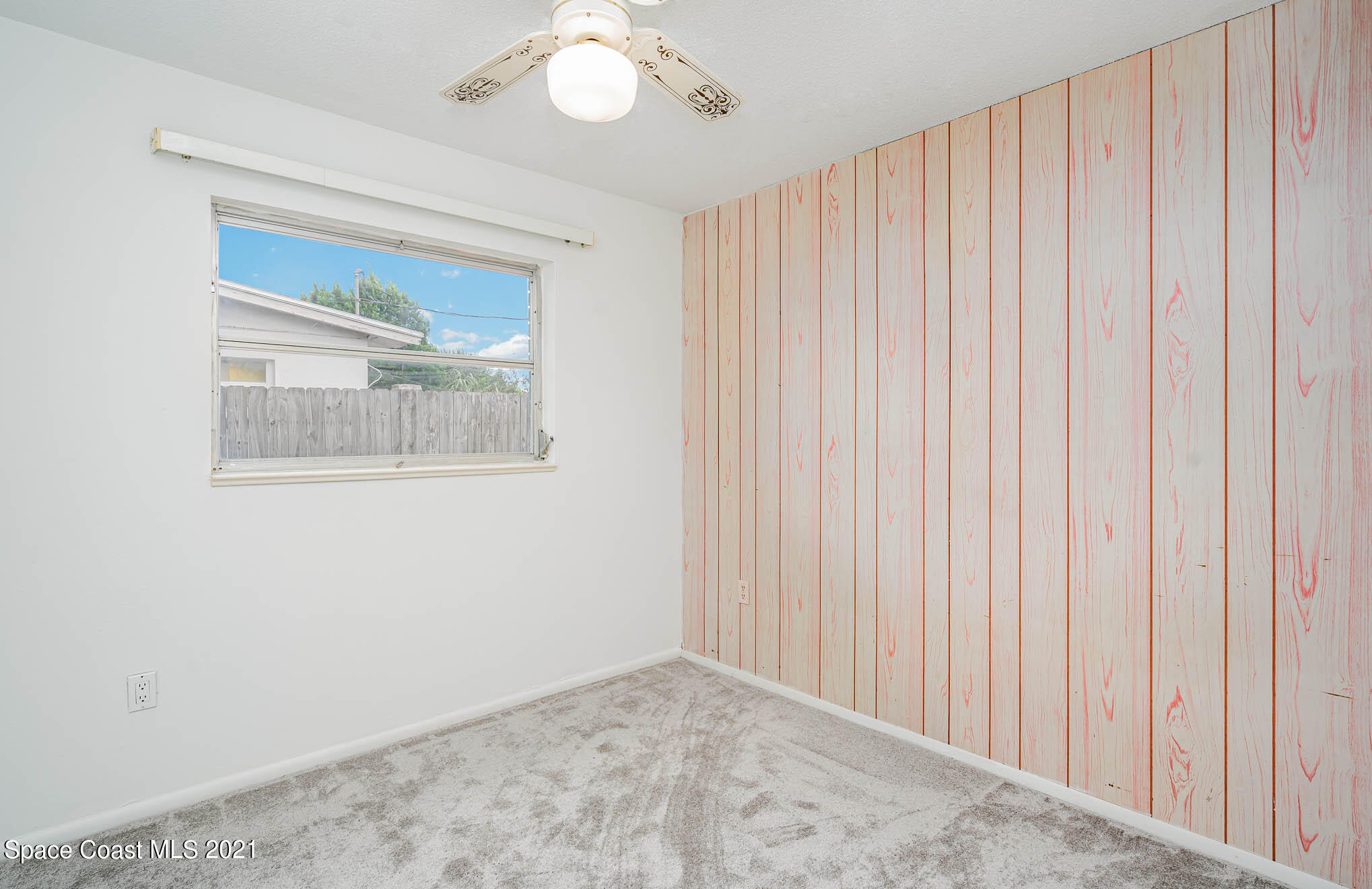 2127 Fatzler Road Melbourne, FL 32935 - Photo 15 of 21 a view of an empty room with a window