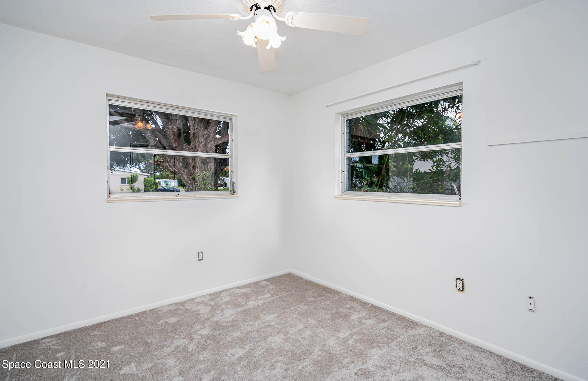 2127 Fatzler Road Melbourne, FL 32935 - Photo 16 of 21 an empty room with a window