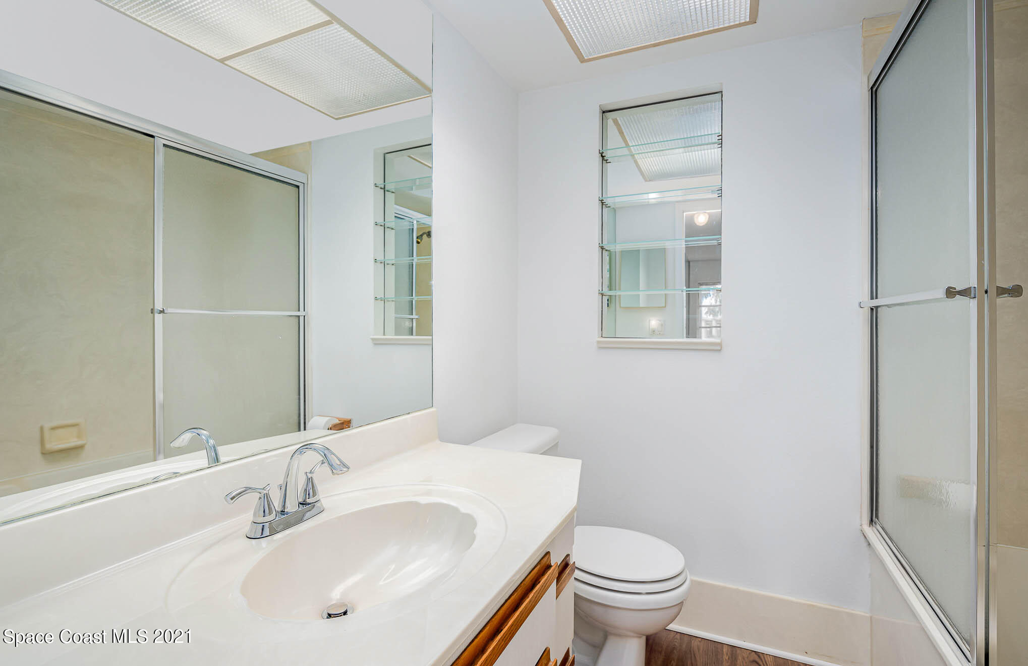 2127 Fatzler Road Melbourne, FL 32935 - Photo 17 of 21 a bathroom with a sink a toilet and shower
