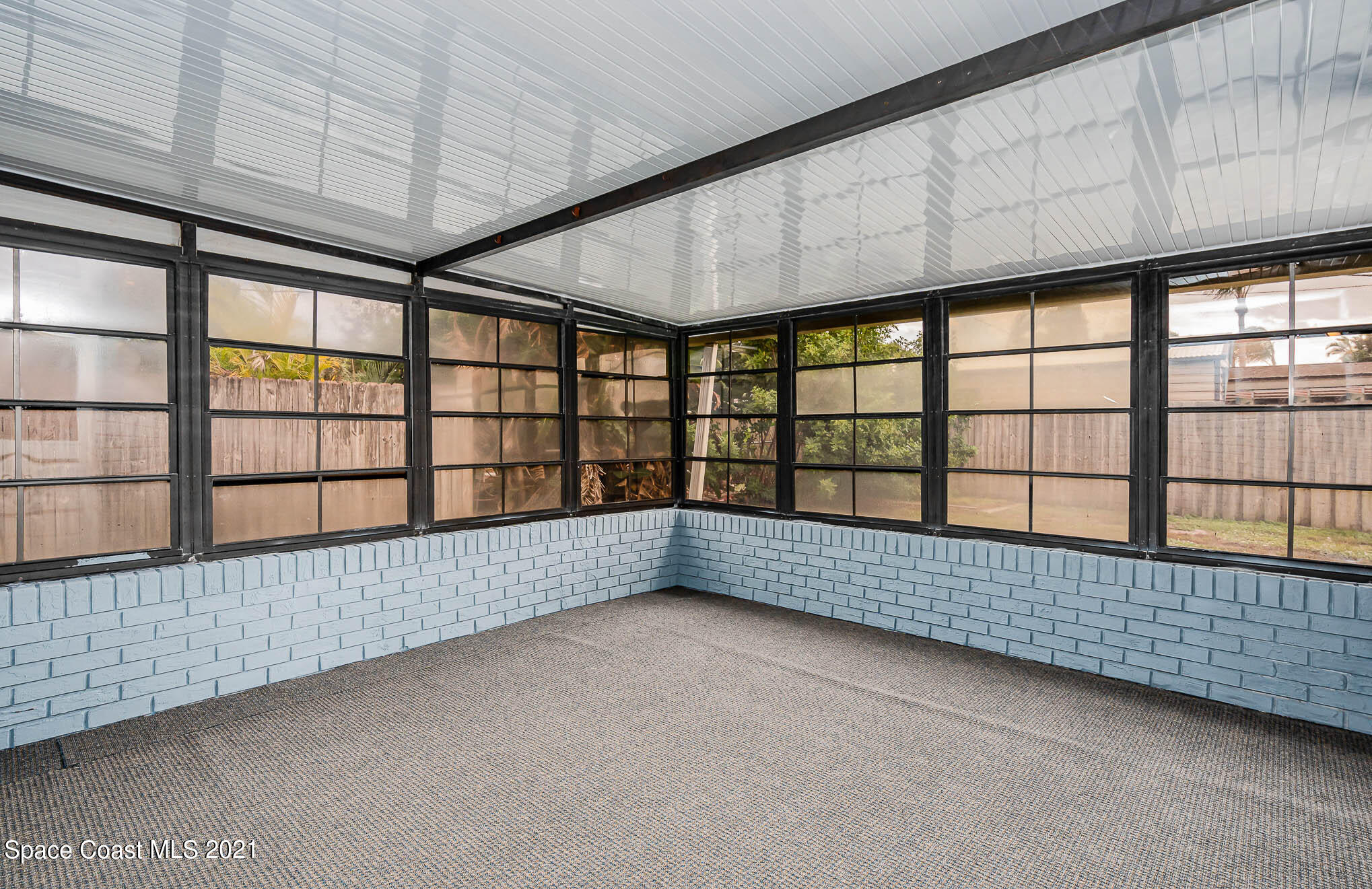 2127 Fatzler Road Melbourne, FL 32935 - Photo 18 of 21 a view of an empty room with a window