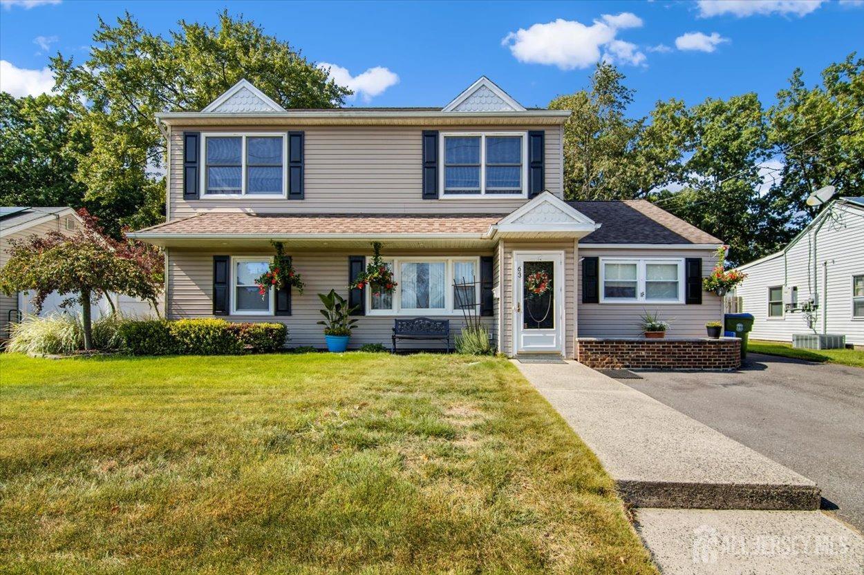 63 Glenville Road Edison, NJ 08817 - Photo 2 of 38 a front view of a house with a garden